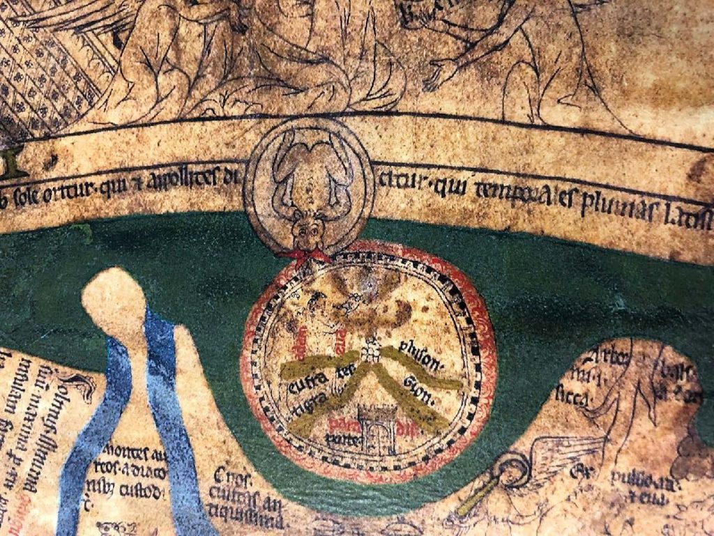 Detail of the Garden of Eden from the Hereford Mappa Mundi. The garden is draw in a circle with decorative black lines and is separated into several sections with gold colored ink. It is ringed in red and surrounded by green ink. Adam and Eve stand next to the tree of knowledge.