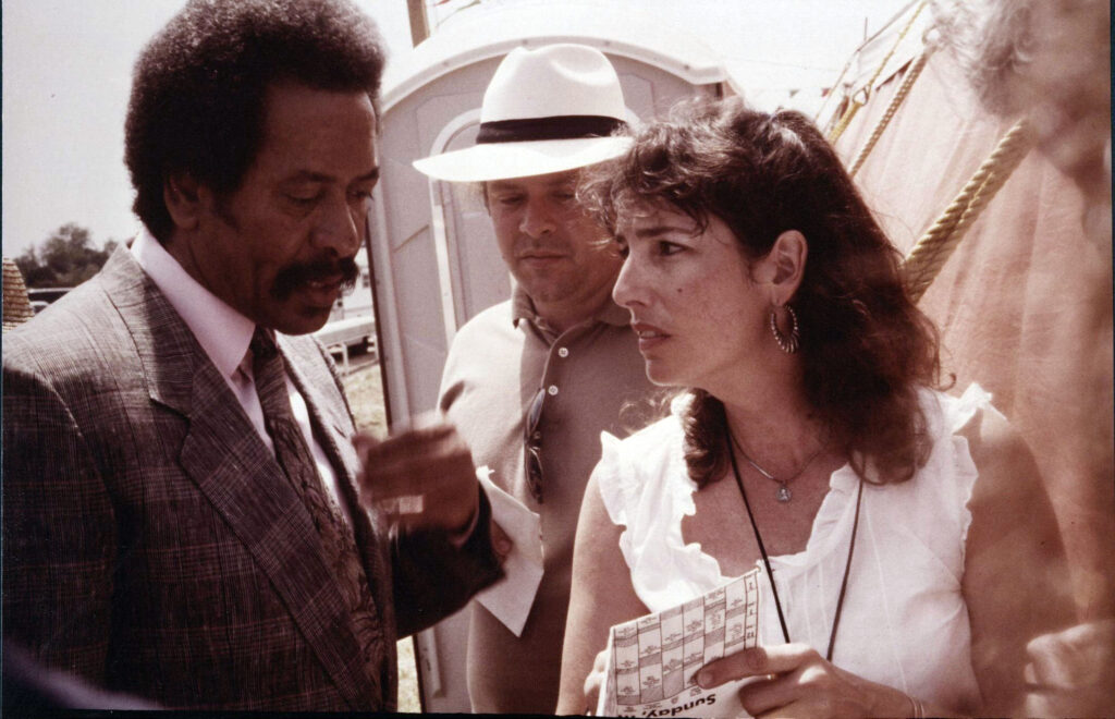 Photo of l. to r.: Allen Toussaint, unidentified man, Allison Miner; May 7, 1989, Jazz Fest, photographer: J. W. Heinze, Allison Miner papers HJA-039, “Photos” box, Tulane University Special Collections.
