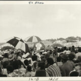 Crowd surrounds brass band at Jazz Fest, undated circa 1970s, photographer: Jay Andersen, Mina Lea Crais collection HJA-060, 117.095, Tulane University Special Collections.