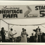 Louisiana Heritage Fair Stage 5, with band featuring Danny Barker, banjo; Blue Lu Barker, vocals; and Frank Naundorf, trombone, 1974, Jazz Fest, photographer unidentified, Mina Lea Crais collection HJA-060, 117.090, Tulane University Special Collections.