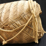 Close- up of Xavante basket with braided strap and lid