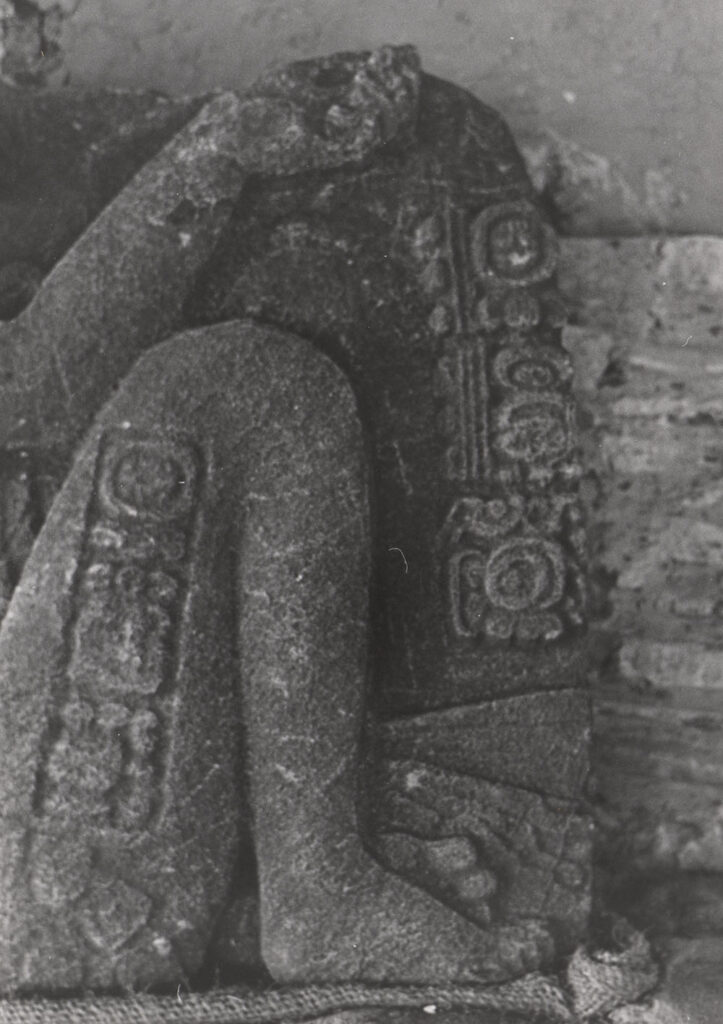 Detail of carved monument showing glyphic inscription