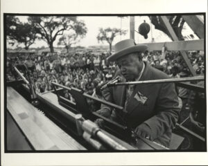 Roosevelt Sykes at piano, 1974, New Orleans Jazz & Heritage Festival, photographer: Michael P. Smith, Robert Palmer collection HJA-027, Box 268, 219.8572, Tulane University Special Collections.