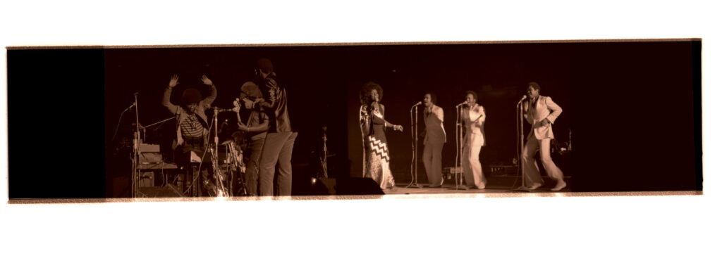 Negative strip of (left) Herbie Hancock and the Headhunters at the Jazz Fest night concert on Friday, April 19, 1974, Municipal Auditorium; and (right) Gladys Knight and The Pips performing at the Jazz Fest night concert on Friday, April 19, 1974, Municipal Auditorium, photographer unidentified, Tad Jones collection HJA-056, Box 28, Tulane University Special Collections.
