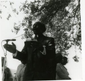 An unidentified minister preaches on stage at the 1971 Jazz Fest, photographer unidentified; Allison Miner papers HJA-039, “Photos” box, Tulane University Special Collections.
