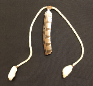 Xavante necktie with brown and white feather