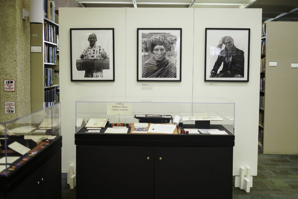 View of Daniel Chauche’s photos about exhibit cases 3 and 4.