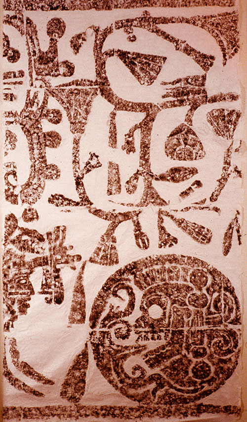 Rubbing of a relief sculpture depicting a tree and human skull