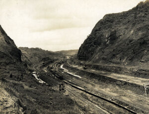 Train tracks cut through a mountain range.